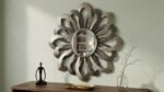 Lunar Unmasking Round Wall Mirror featuring beveled glass